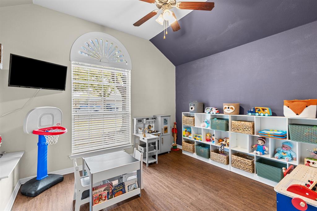 10616 Whitney Trace Drive Waco, TX 76708 - Photo 24 of 37 a bedroom with furniture and a chandelier