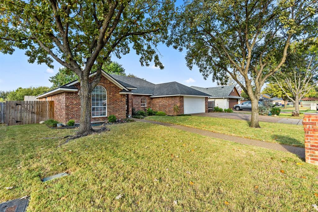 10616 Whitney Trace Drive Waco, TX 76708 - Photo 4 of 37 a house with trees in front of it