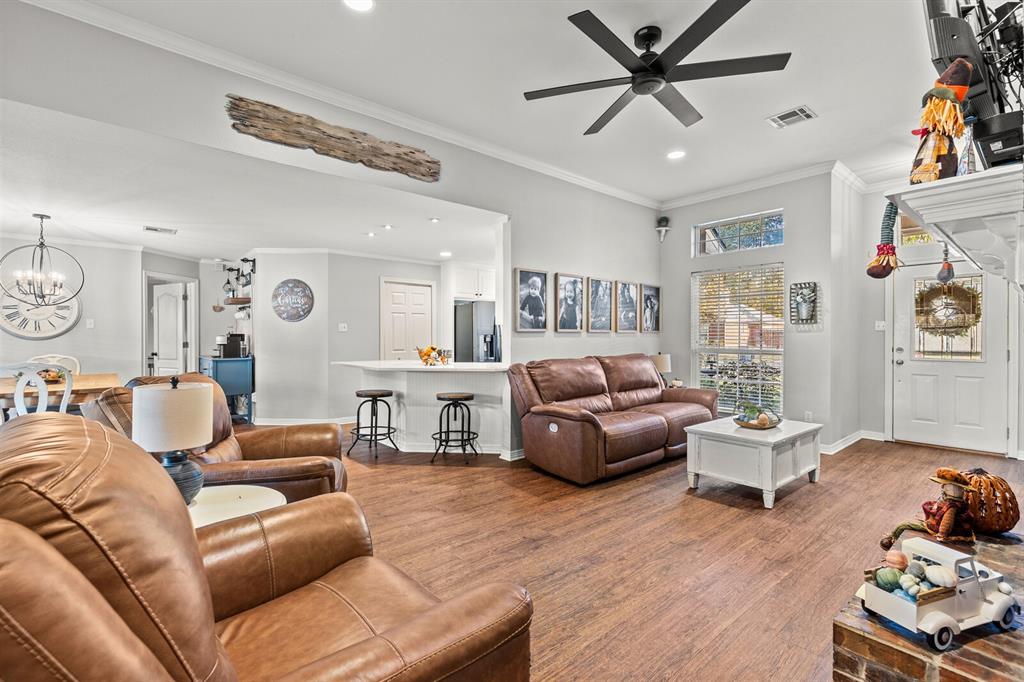 10616 Whitney Trace Drive Waco, TX 76708 - Photo 10 of 37 a living room with furniture or couch and a wooden floor