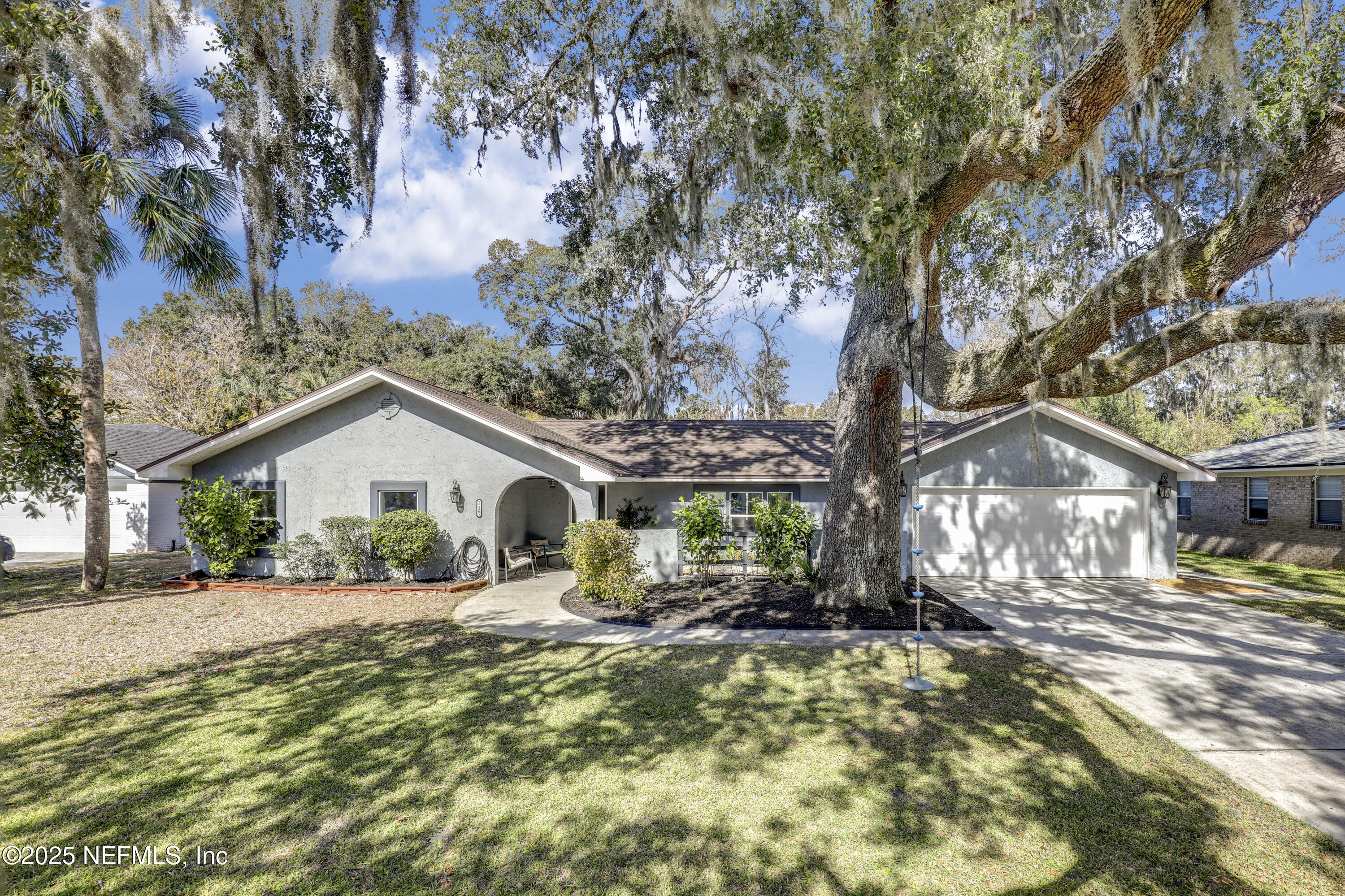 11265 Beacon Drive Jacksonville, FL 32225 - Photo 1 of 62 a front view of a house with a yard