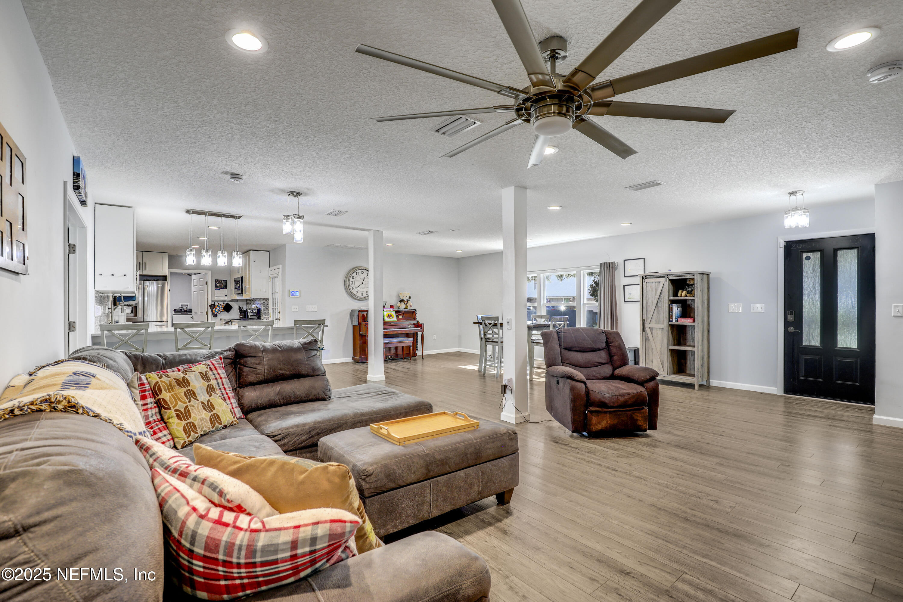 11265 Beacon Drive Jacksonville, FL 32225 - Photo 14 of 62 a living room with furniture and a wooden floor