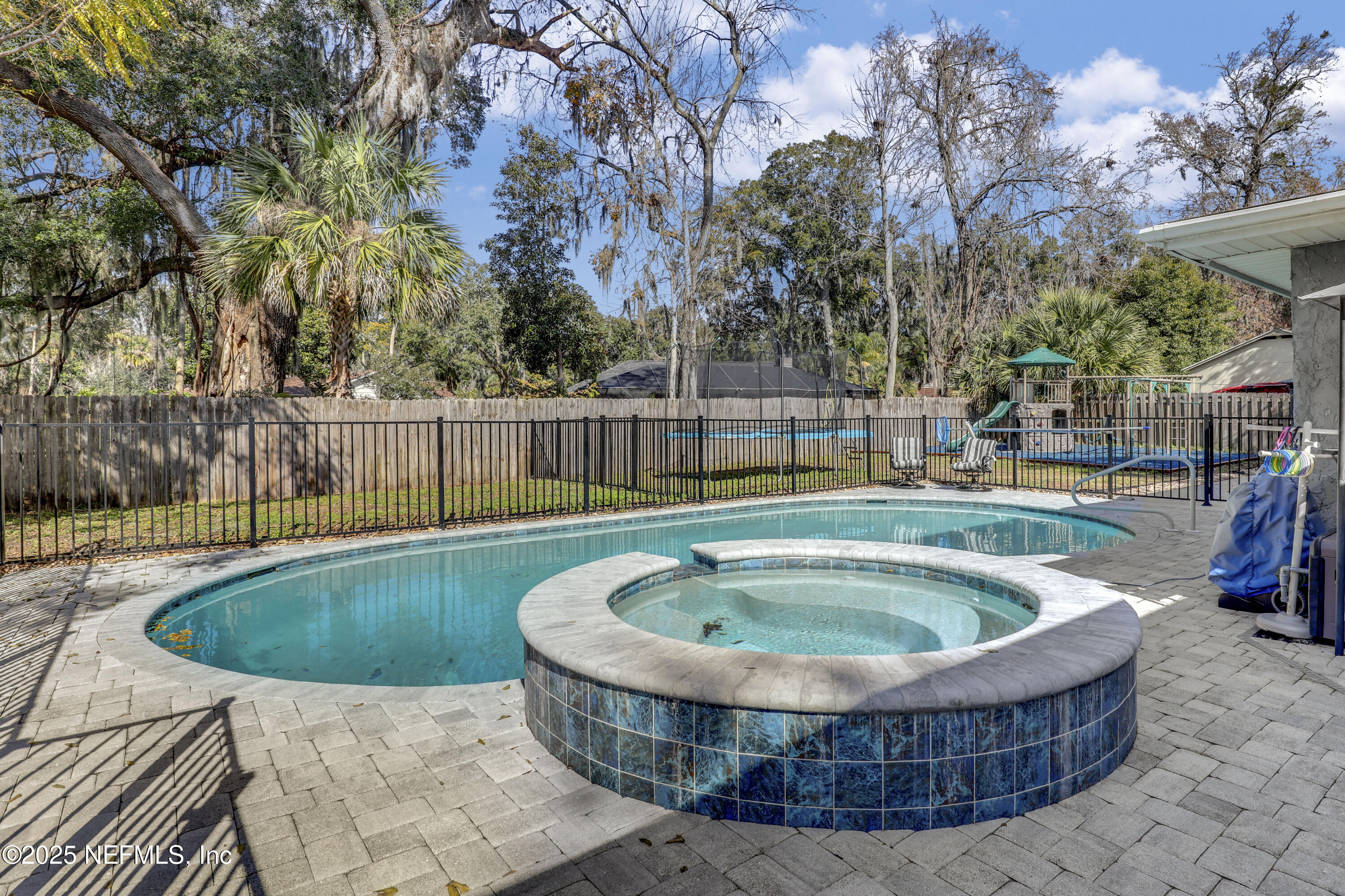 11265 Beacon Drive Jacksonville, FL 32225 - Photo 2 of 62 a view of a swimming pool with a patio