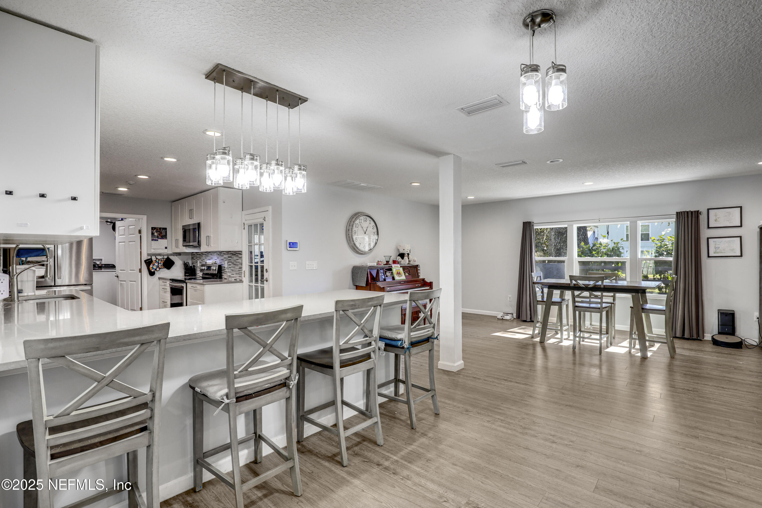 11265 Beacon Drive Jacksonville, FL 32225 - Photo 22 of 62 a view of a dining room with furniture window and wooden floor
