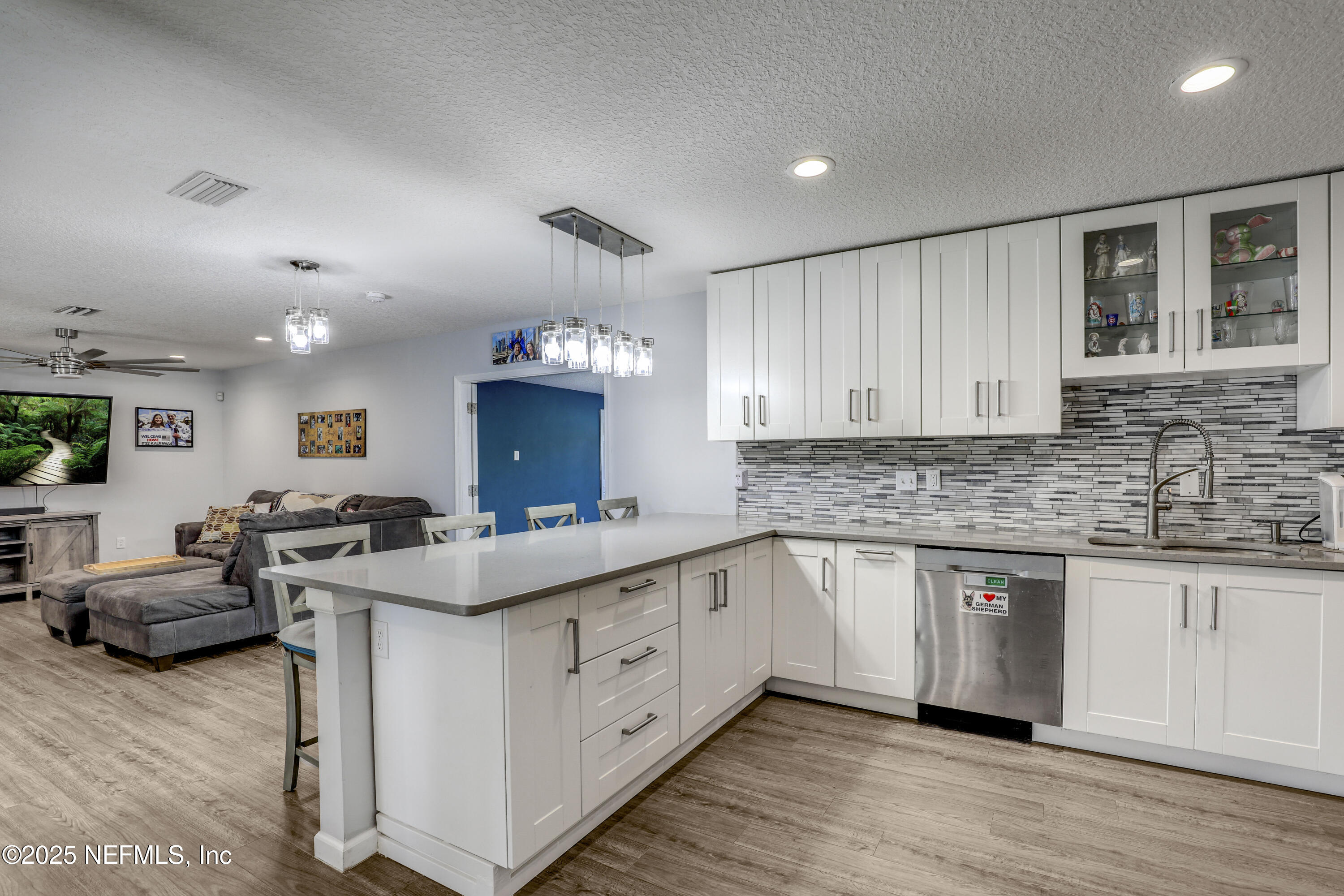 11265 Beacon Drive Jacksonville, FL 32225 - Photo 27 of 62 a kitchen with a sink stove and cabinets