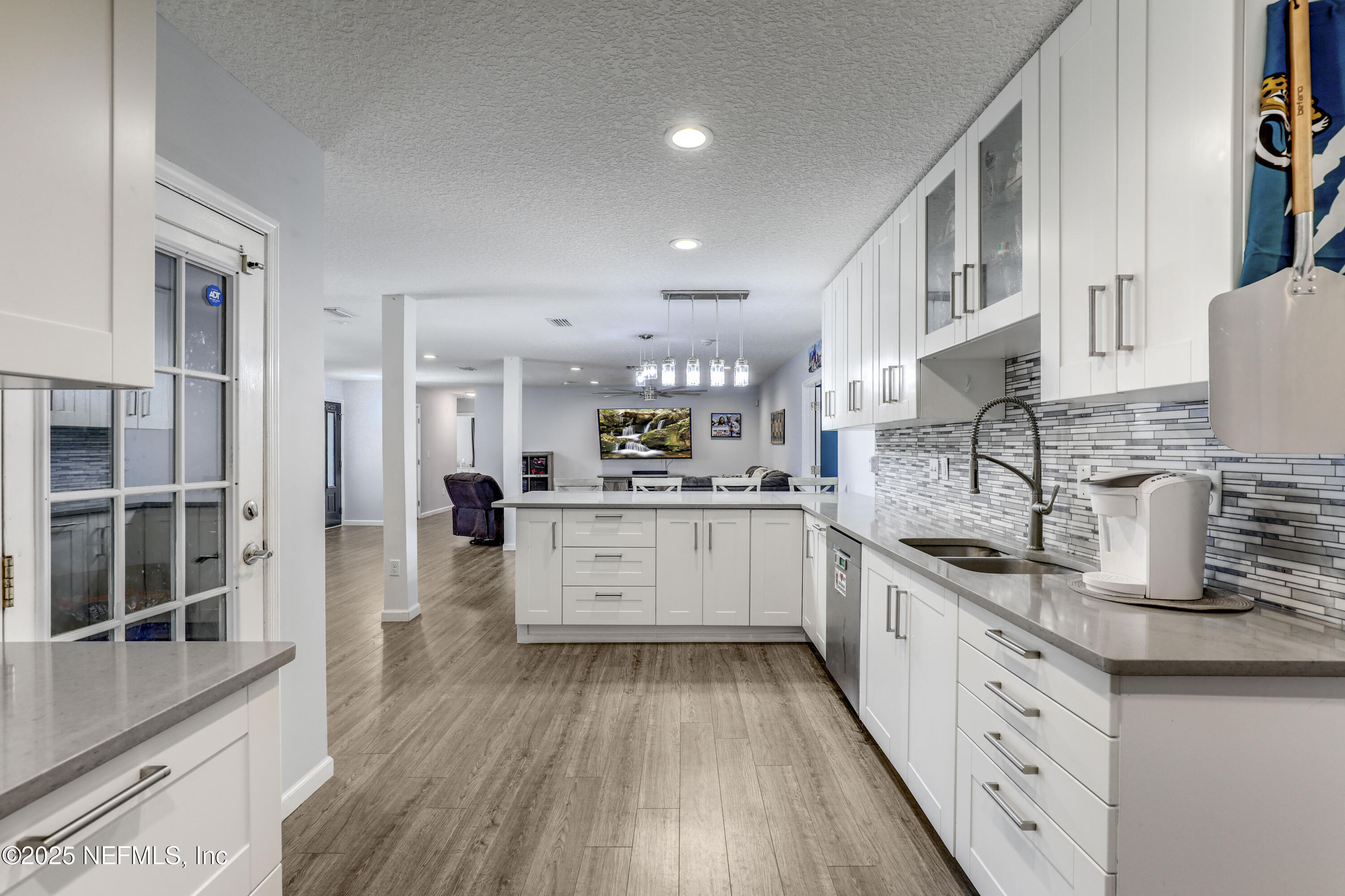 11265 Beacon Drive Jacksonville, FL 32225 - Photo 3 of 62 a large kitchen with stainless steel appliances granite countertop a lot of counter space and wooden floors