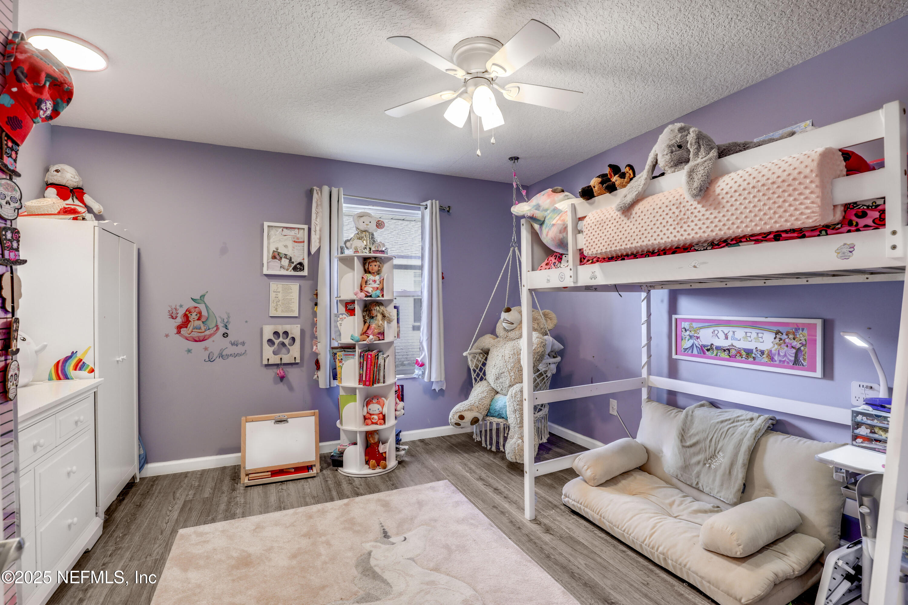 11265 Beacon Drive Jacksonville, FL 32225 - Photo 37 of 62 a living room with furniture and a flat screen tv