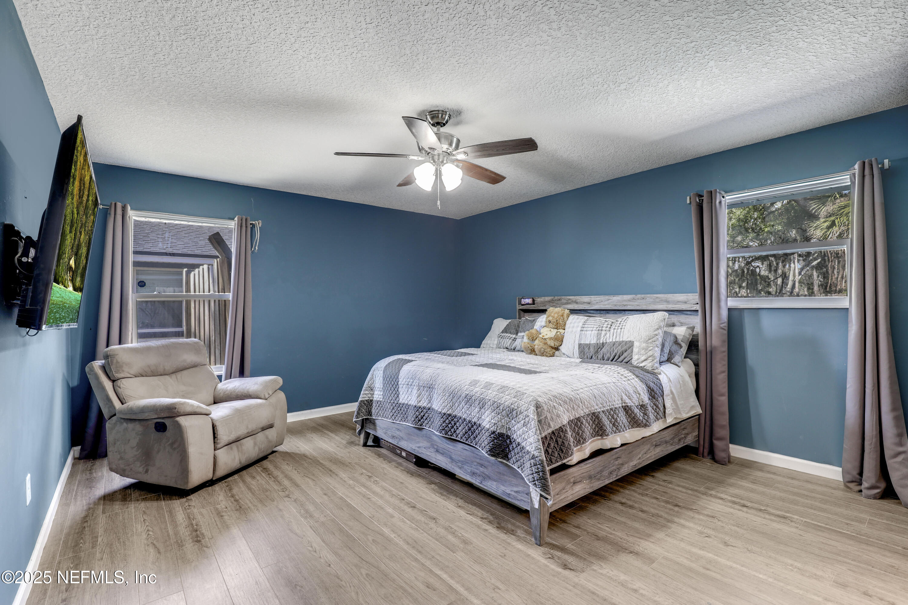 11265 Beacon Drive Jacksonville, FL 32225 - Photo 41 of 62 a bedroom with a bed and a couch