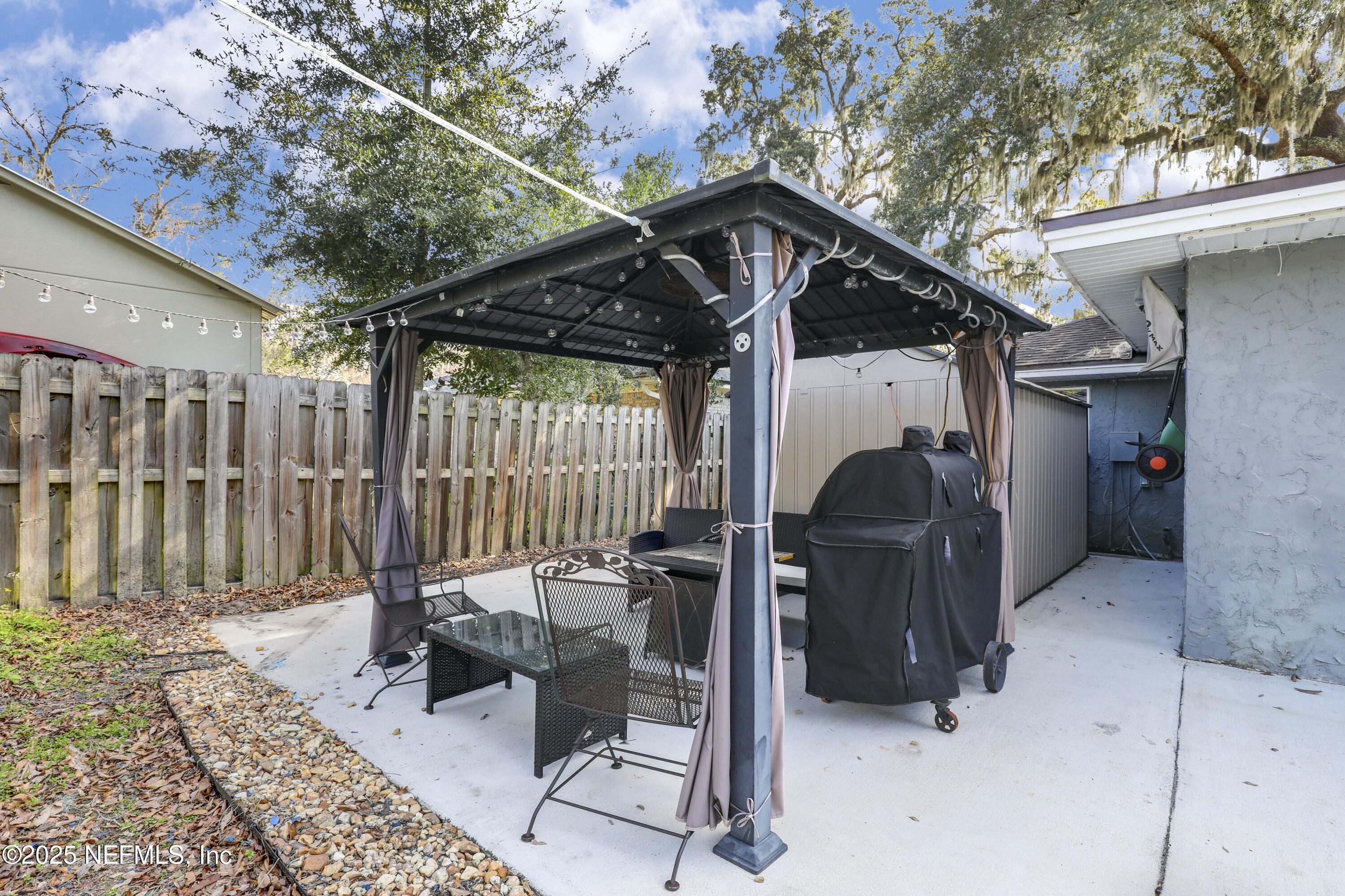 11265 Beacon Drive Jacksonville, FL 32225 - Photo 49 of 62 a view of a chairs and table in the patio