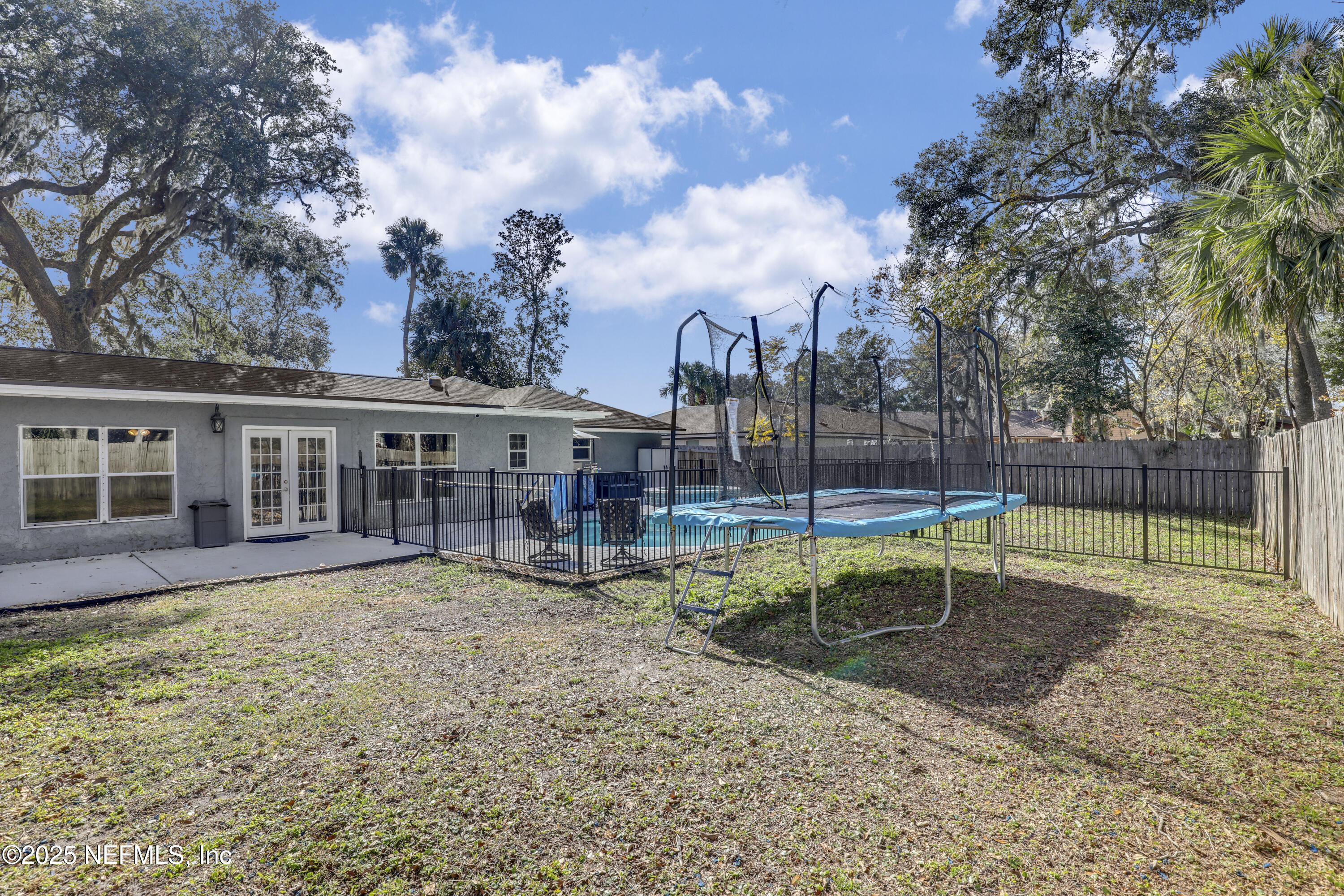 11265 Beacon Drive Jacksonville, FL 32225 - Photo 55 of 62 a view of a house with a yard and sitting area