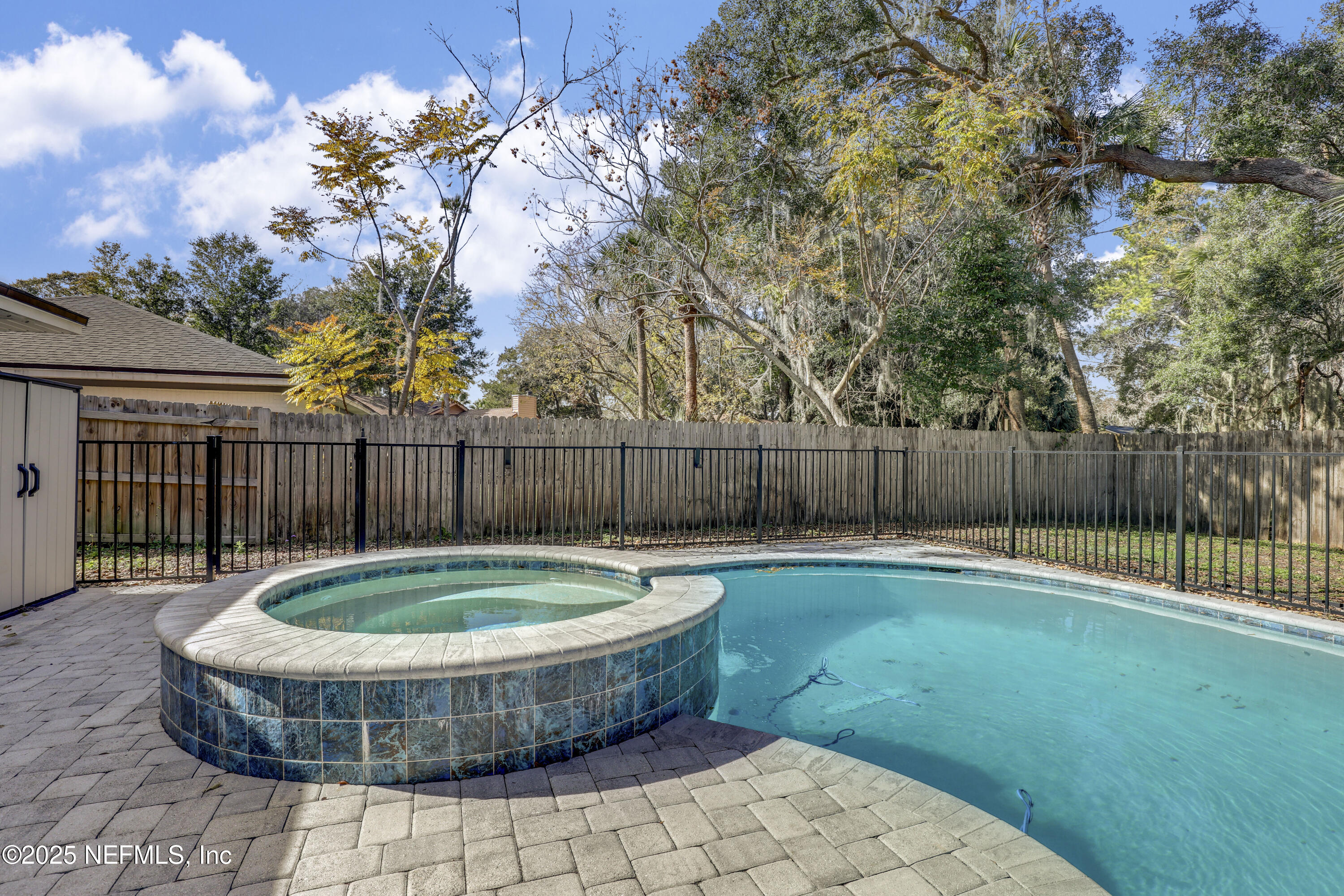 11265 Beacon Drive Jacksonville, FL 32225 - Photo 58 of 62 a view of a backyard with swimming pool and wooden fence