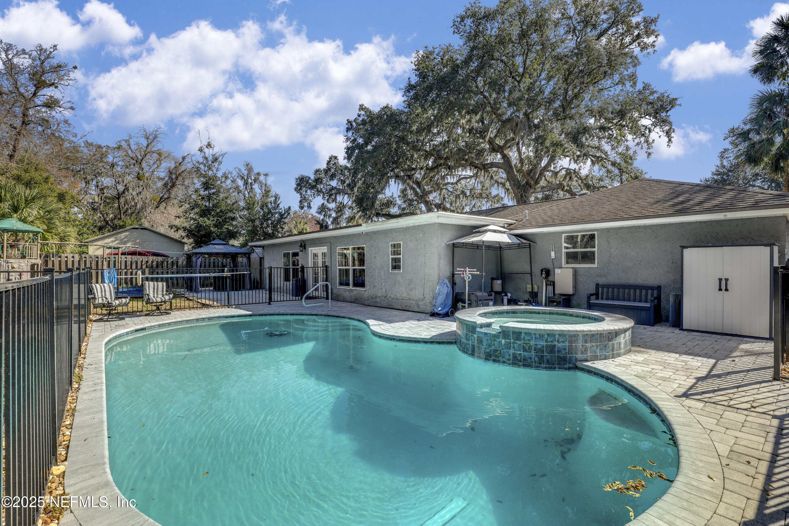 11265 Beacon Drive Jacksonville, FL 32225 - Photo 59 of 62 a view of a house with backyard sitting area and garden