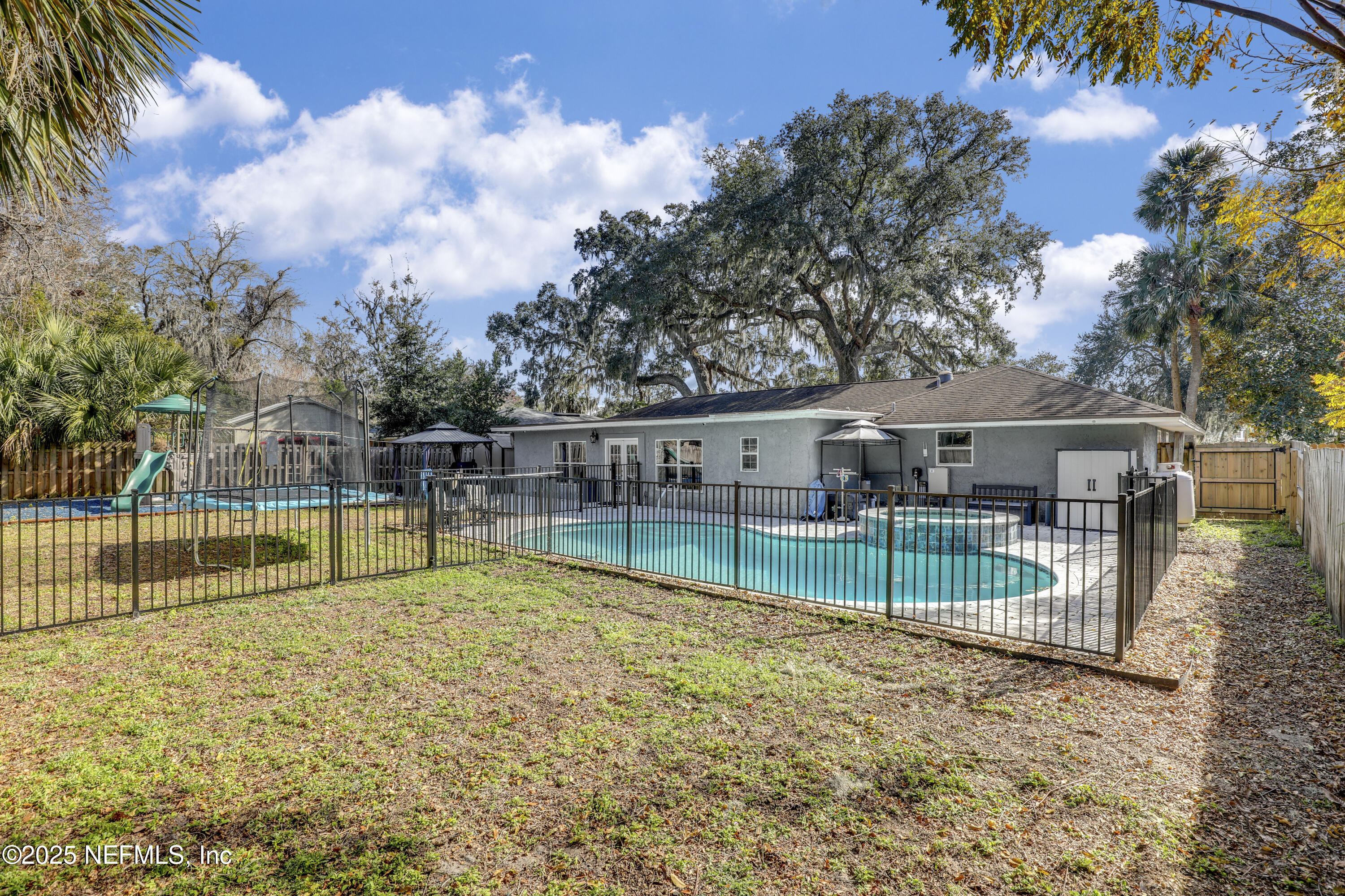 11265 Beacon Drive Jacksonville, FL 32225 - Photo 61 of 62 a view of house with a backyard and swimming pool