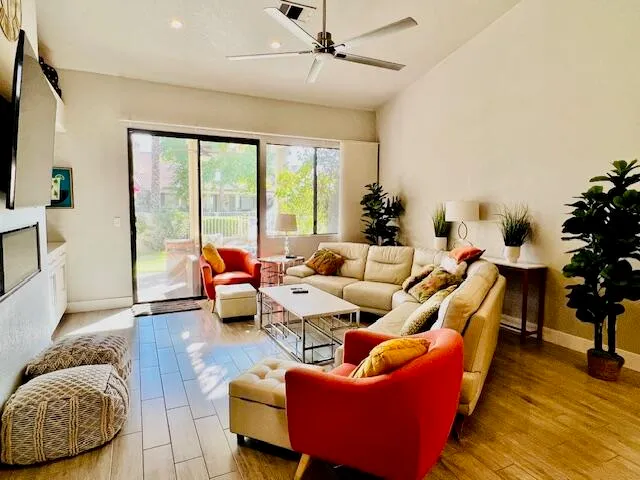 a living room with furniture and a large window