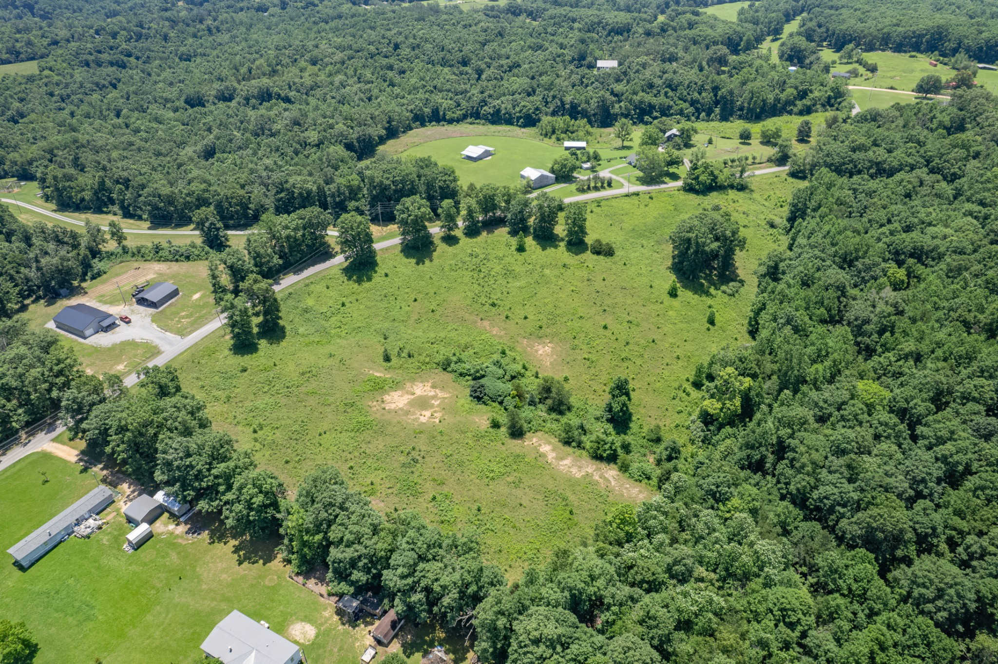 0 Mobley Ridge Road Duck River, TN 38454 - Photo 5 of 35 a view of a green yard with large trees