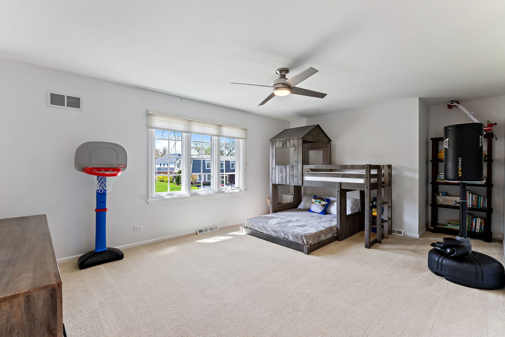 61 Coventry Road Northfield, IL 60093 - Photo 17 of 28 a bedroom with a bed and a chandelier