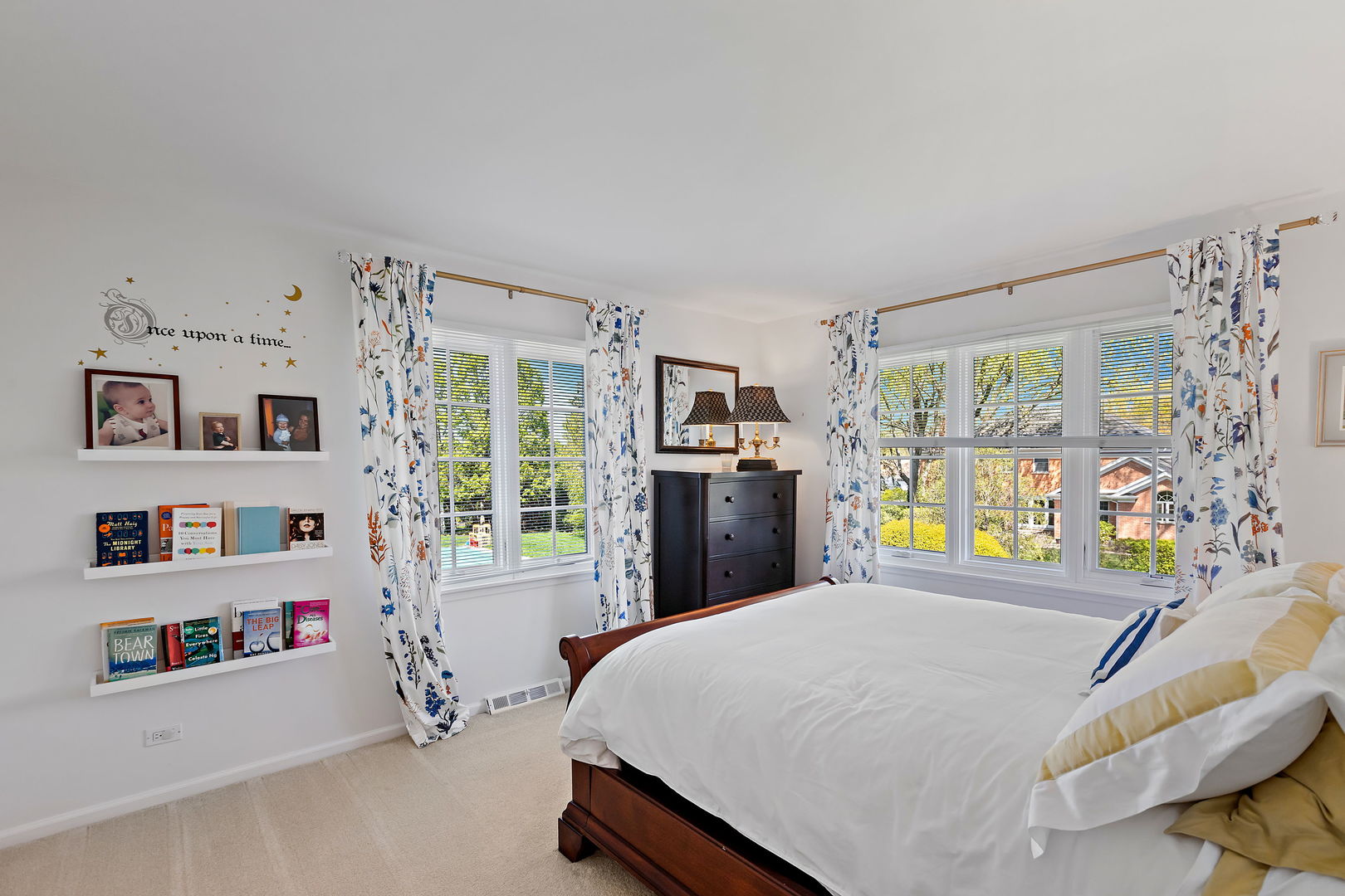 61 Coventry Road Northfield, IL 60093 - Photo 19 of 28 a bed room with a bed and a book shelf