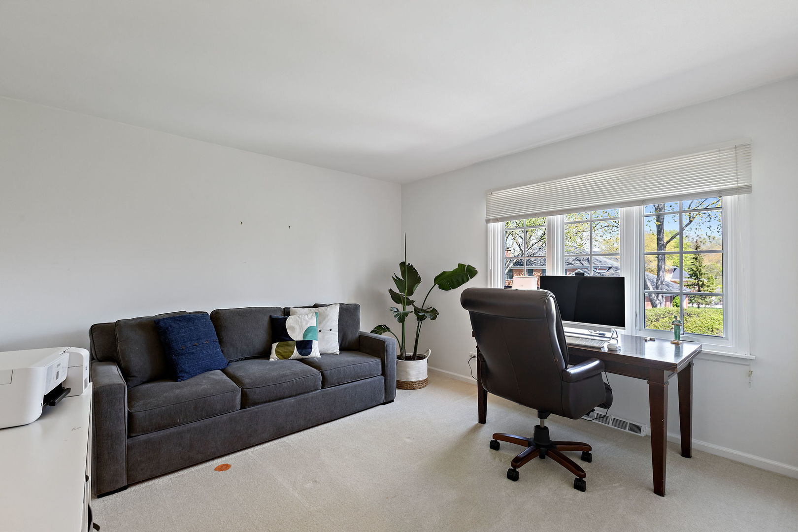 61 Coventry Road Northfield, IL 60093 - Photo 20 of 28 a living room with furniture and a window