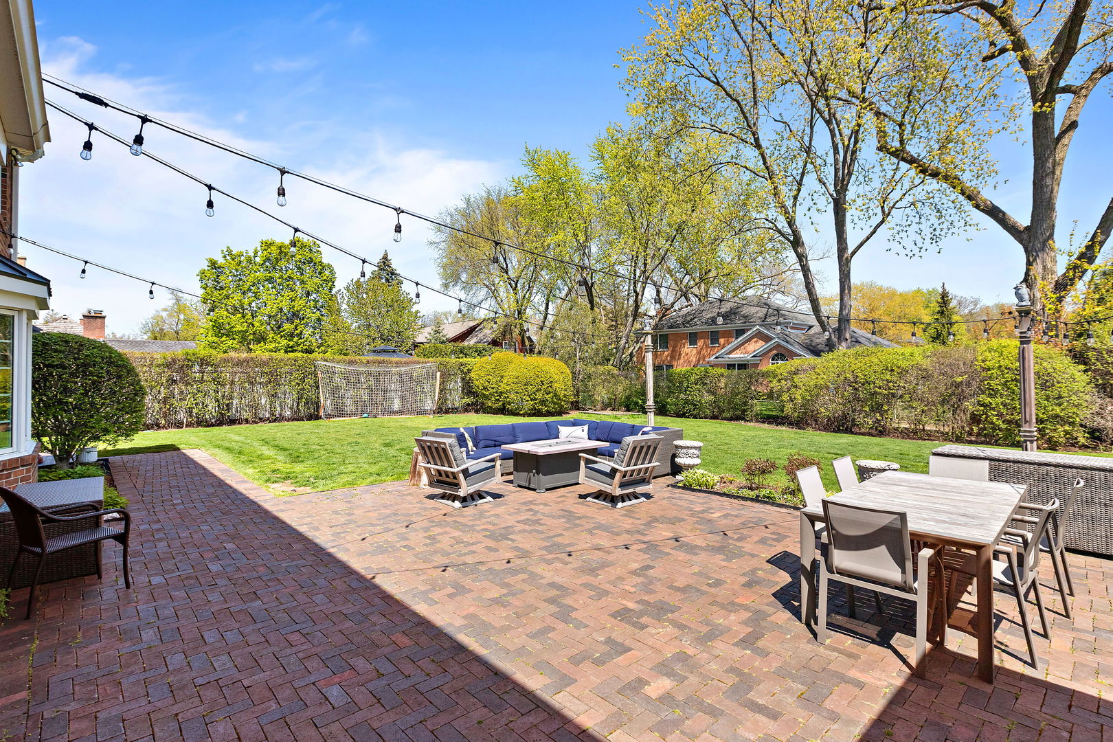 61 Coventry Road Northfield, IL 60093 - Photo 23 of 28 an outdoor sitting area with furniture and a yard