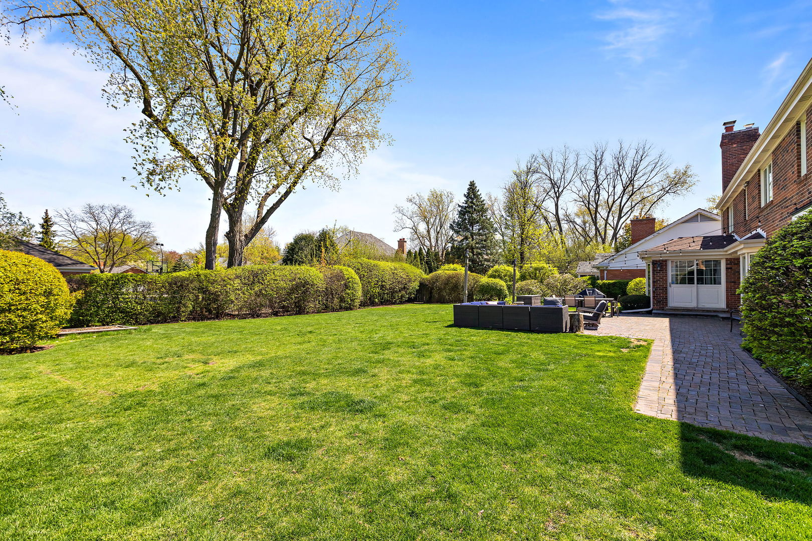 61 Coventry Road Northfield, IL 60093 - Photo 24 of 28 a view of a yard with a house in the background