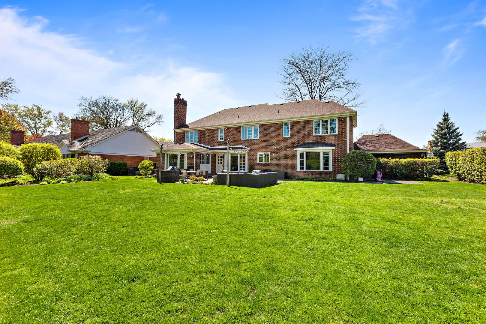 61 Coventry Road Northfield, IL 60093 - Photo 25 of 28 a front view of a house with garden