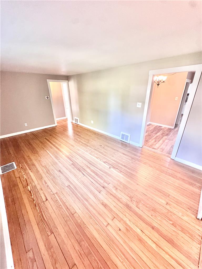 5454 Camp Meeting Road Center Valley, PA 18034 - Photo 5 of 27 Natural light illuminates the richly toned hardwood flooring, enhancing the spacious living area.