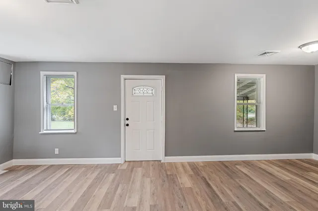 an empty room with windows