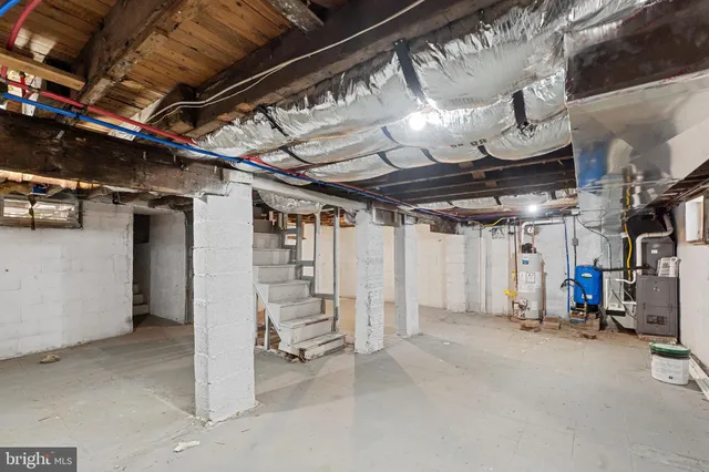 a view of empty room with wooden ceiling