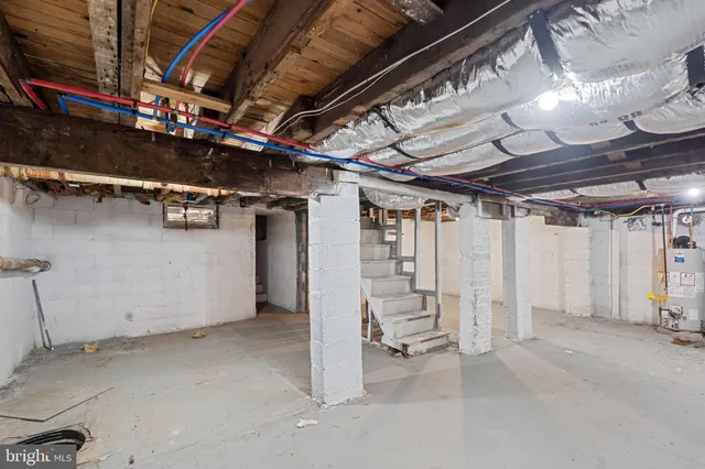 a view of empty room with wooden ceiling