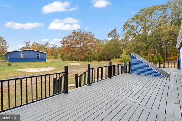 a view of deck with wooden floor and fence