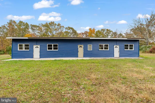 a front view of a house with yard