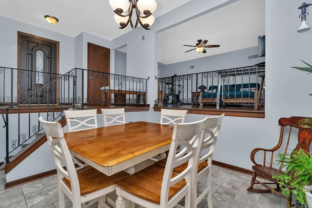 a dining room with furniture and window