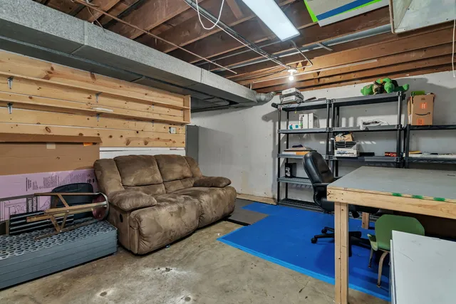 a living room with furniture and a table