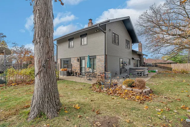 a front view of house with a garden