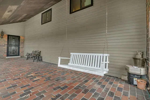 a view of a porch with a bench