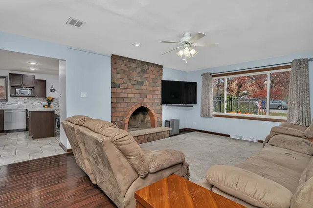 a living room with furniture and a fireplace