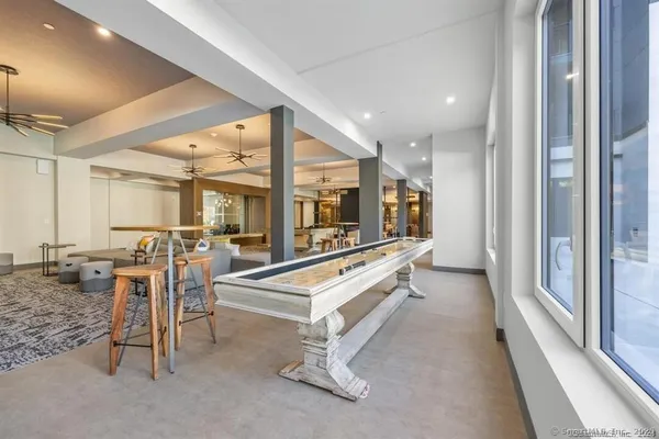 an open kitchen with a table and chairs in it