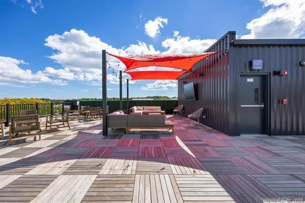 a view of a balcony with dining space