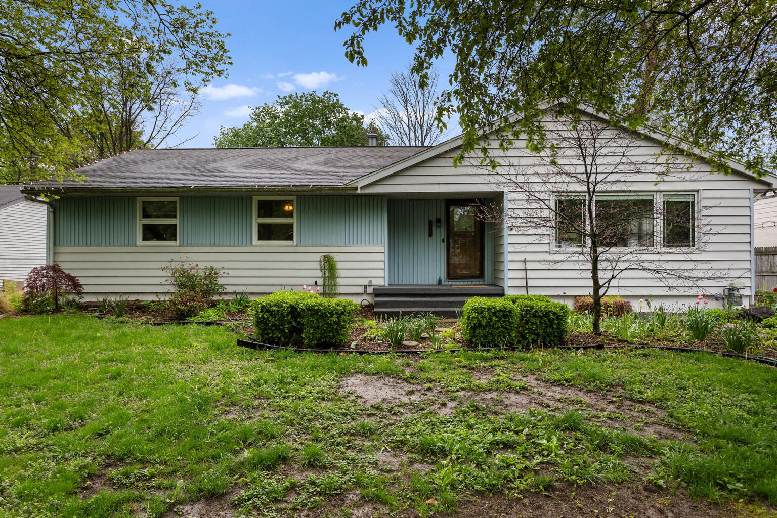 1405 Mayfair Road Champaign, IL 61821 - Photo 1 of 34 a front view of a house with a yard