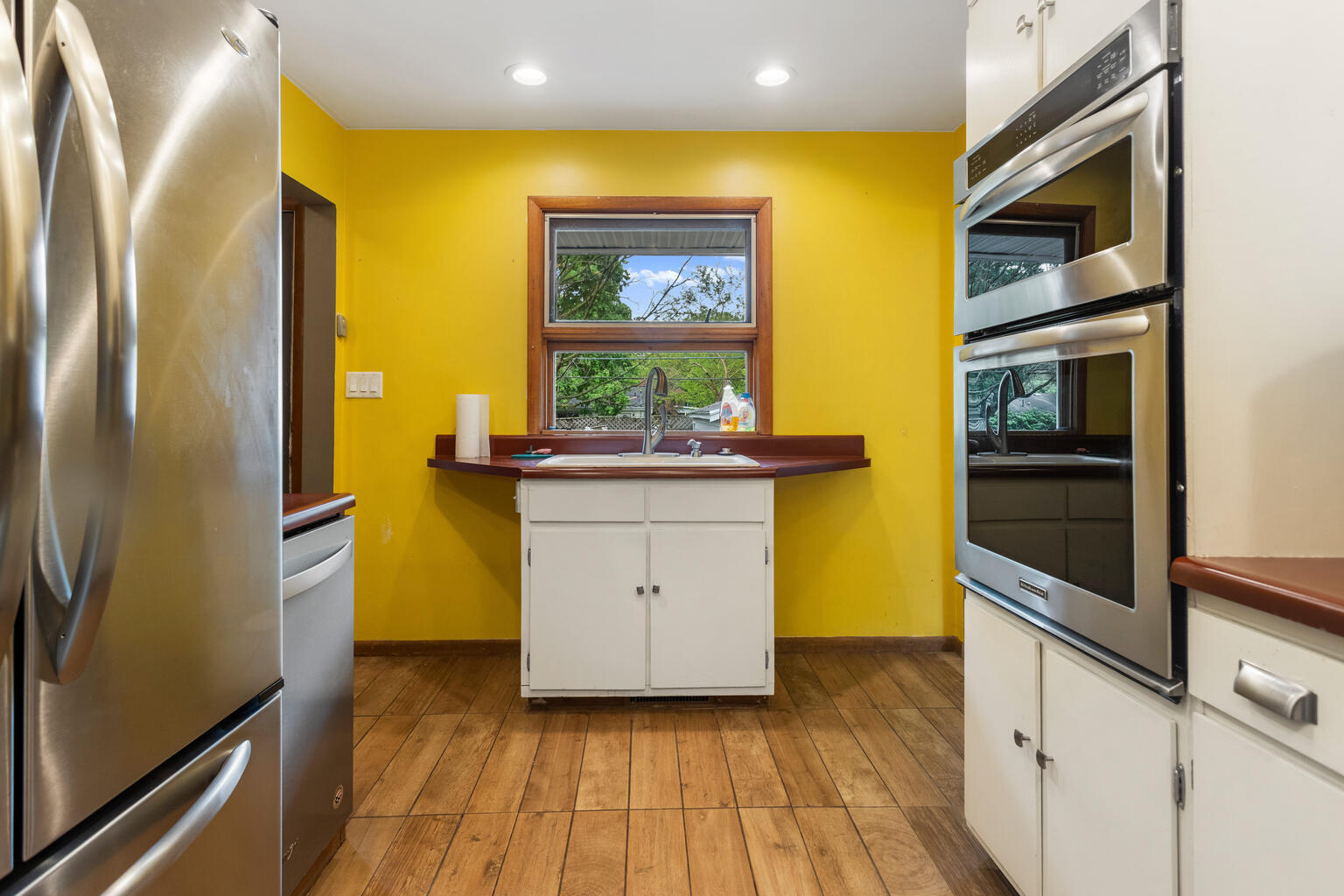 1405 Mayfair Road Champaign, IL 61821 - Photo 13 of 34 a kitchen with a sink and wooden floor