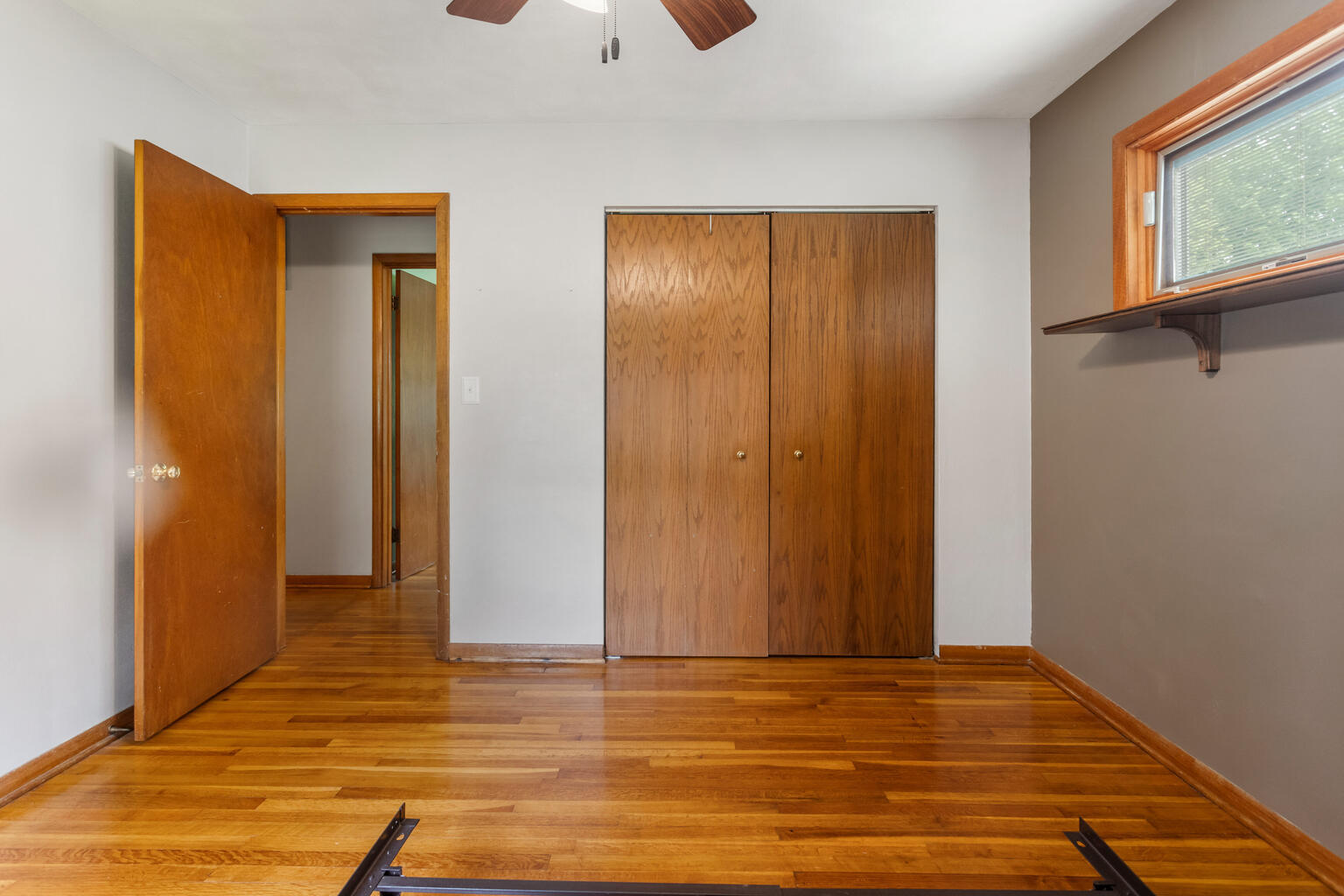 1405 Mayfair Road Champaign, IL 61821 - Photo 20 of 34 a view of an empty room with window and wooden floor