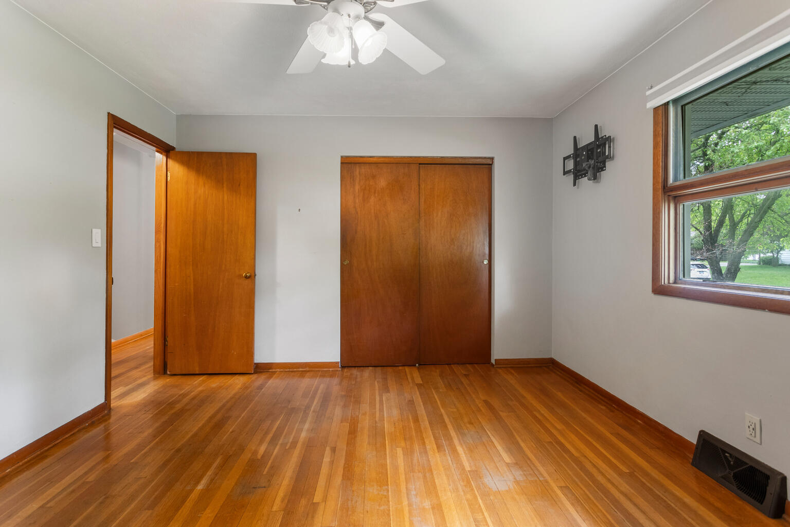 1405 Mayfair Road Champaign, IL 61821 - Photo 22 of 34 an empty room with wooden floor and windows