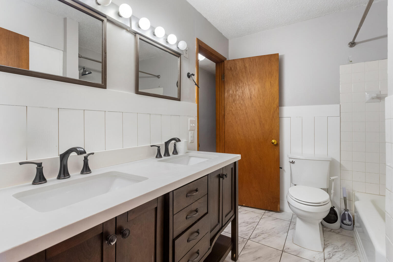 1405 Mayfair Road Champaign, IL 61821 - Photo 25 of 34 a bathroom with a sink a toilet and shower