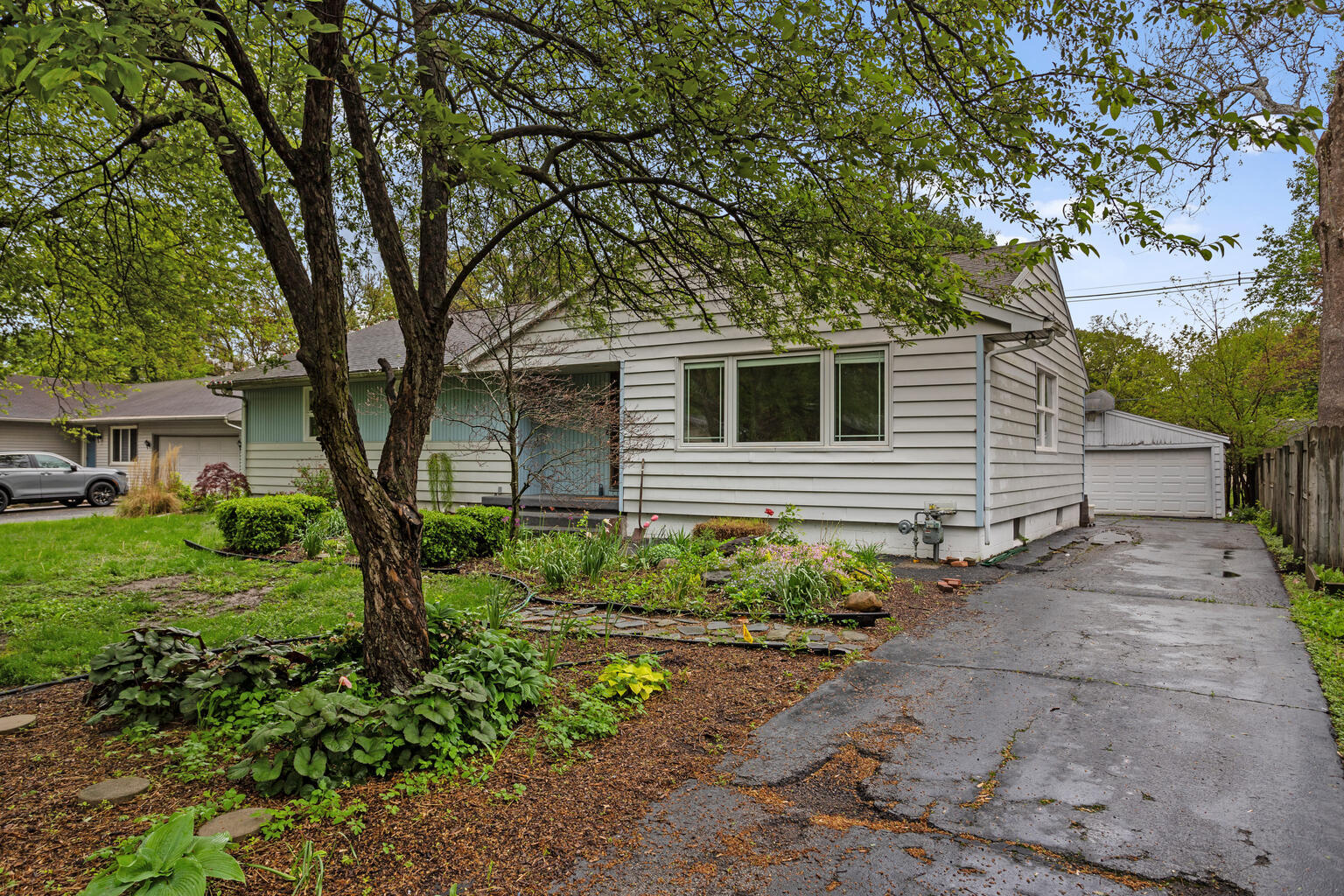 1405 Mayfair Road Champaign, IL 61821 - Photo 3 of 34 a front view of a house with garden