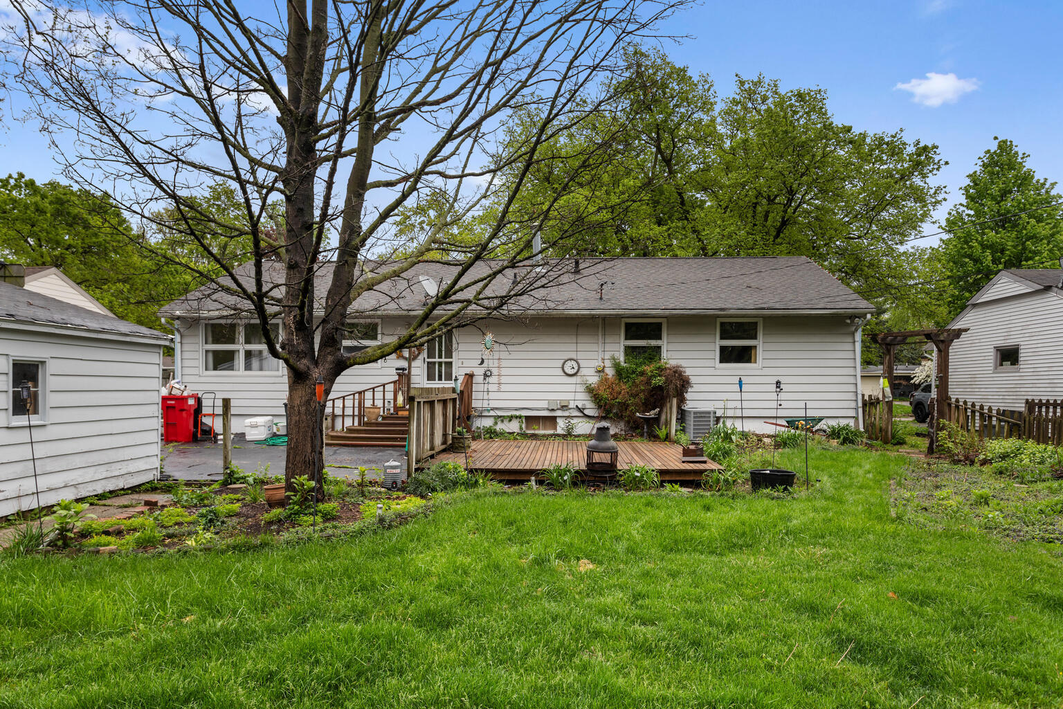 1405 Mayfair Road Champaign, IL 61821 - Photo 4 of 34 a front view of a house with patio