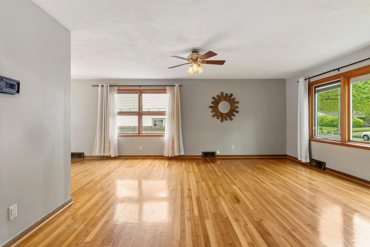 1405 Mayfair Road Champaign, IL 61821 - Photo 8 of 34 wooden floor in an empty room with a window