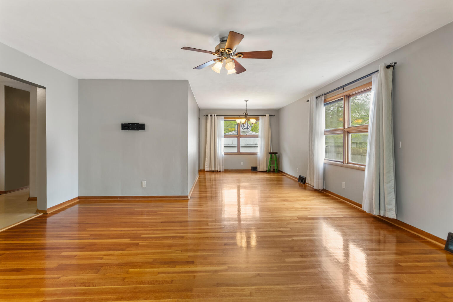 1405 Mayfair Road Champaign, IL 61821 - Photo 9 of 34 a view of an empty room with window and wooden floor