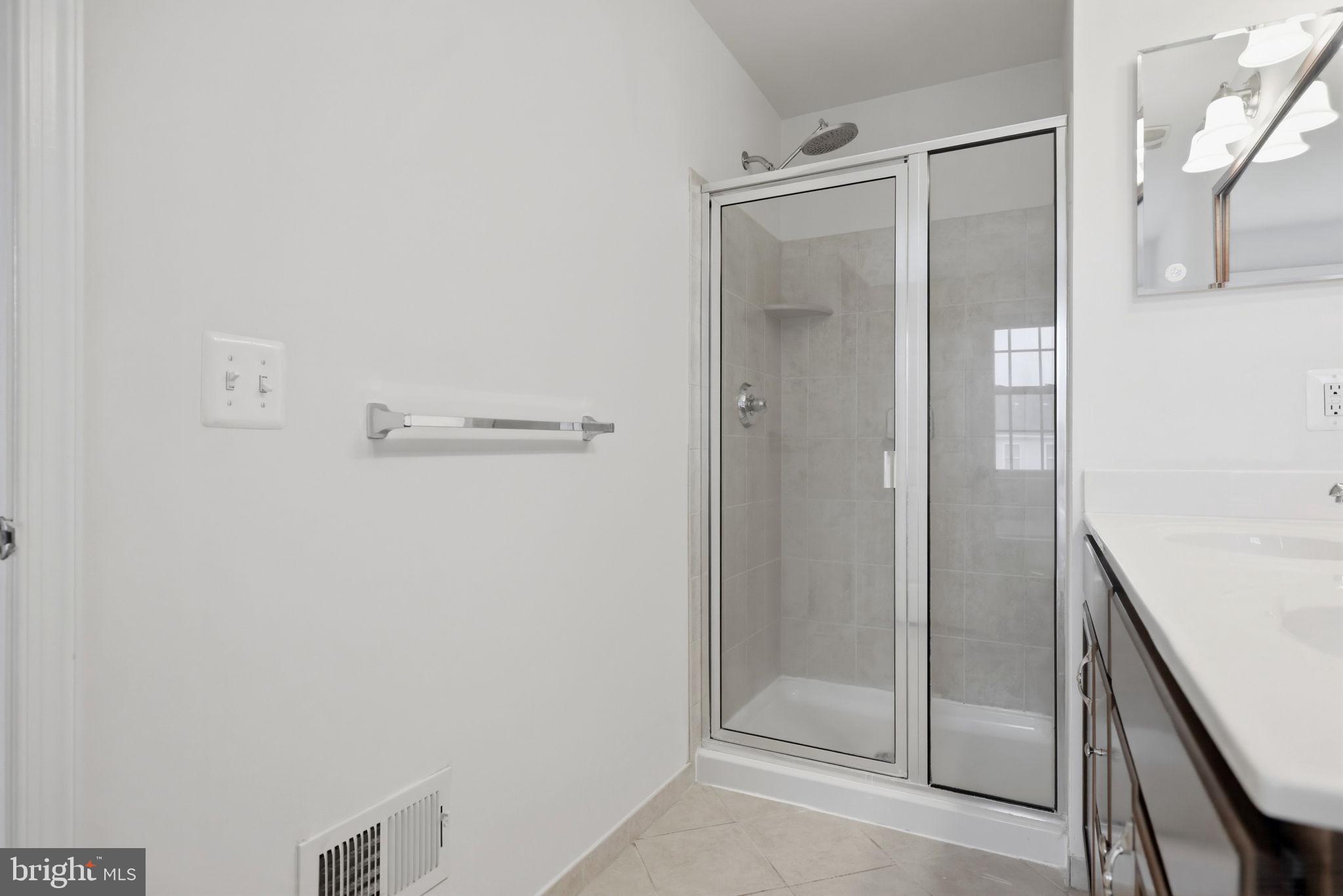 25156 Monteith Terrace Chantilly, VA 20152 - Photo 63 of 72 Modern bathroom with sleek shower design.
