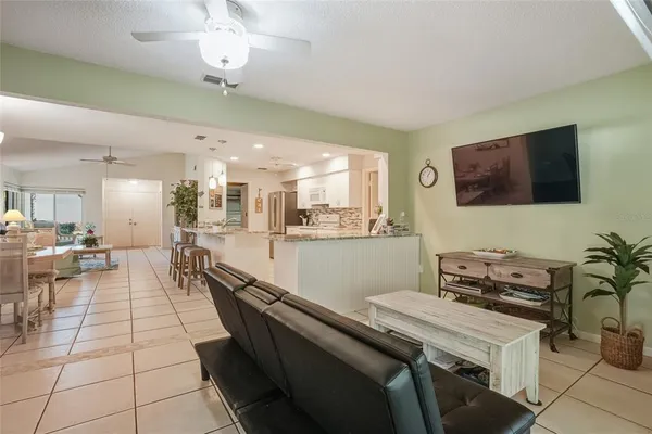 a lobby with furniture and a flat screen tv