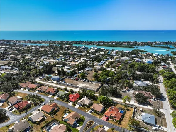 an aerial view of a city with ocean view