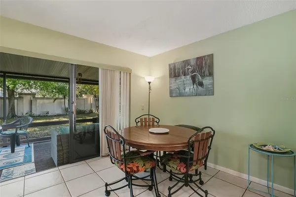 a view of a dining room with furniture and a window